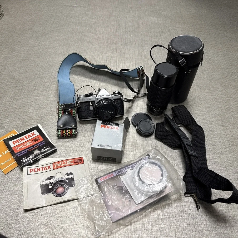 Pentax ME Super 35mm SLR Film Camera with 50 mm lens And Pentax Flash Extras Lot